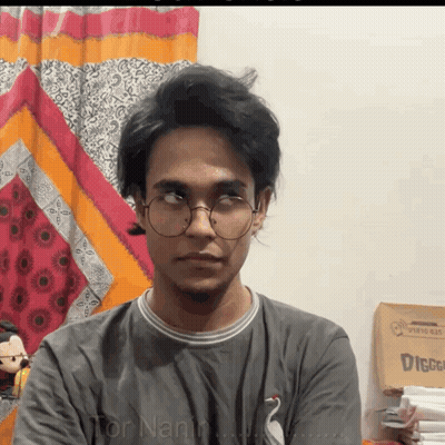 Young Man With Glasses And Tor Nanin Shirt GIF