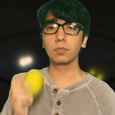 Young Man With Glasses Holding Tennis Ball GIF