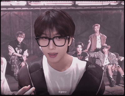 Young Man With Glasses In Front Of Young Men GIF