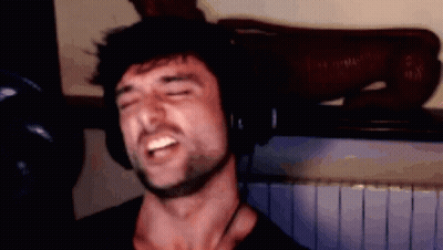 Young Man With Glasses Smiling Tongue Out GIF