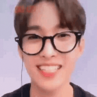 Young Man With Glasses Smiling Tongue Out GIF