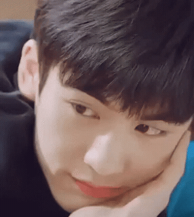 Young Man With Hand On Face GIF