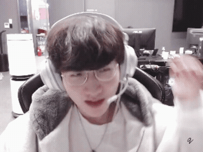 Young Man With Headphones And Glasses At Computer GIF