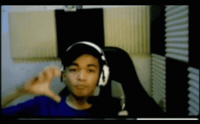 Young Man With Headphones And Hat Thumbs Down GIF