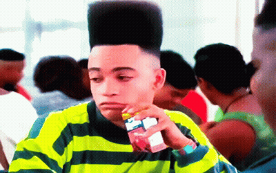 Young Man With High Top Hairstyle Drinking Juice GIF