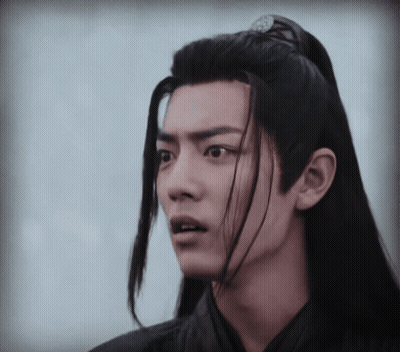 Young Man With Long Black Hair Making Funny Face GIF