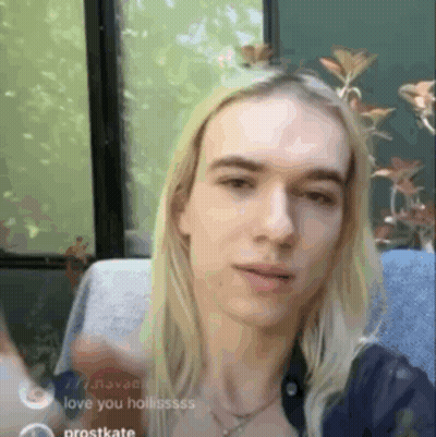 Young Man With Long Blonde Hair Waving GIF