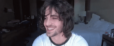 Young Man With Long Curly Hair Smiling GIF