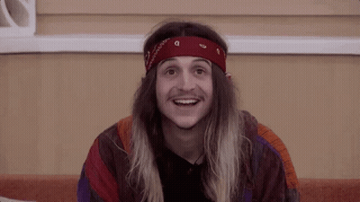 Young Man With Long Hair And Red Bandana Smiling GIF