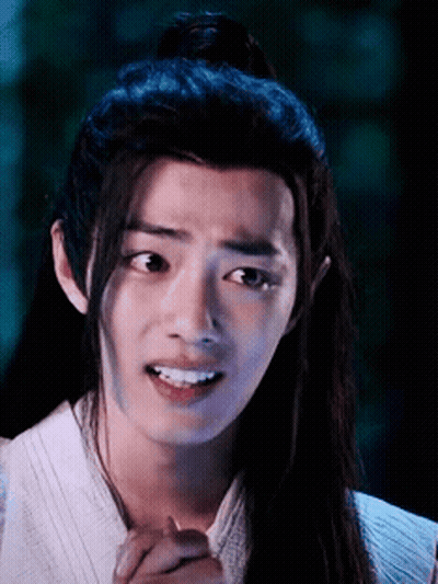 Young Man With Long Hair Making Funny Face GIF