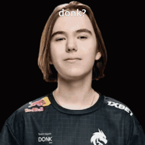 Young Man With Long Hair Wearing Black Shirt With Red Bull Logo GIF