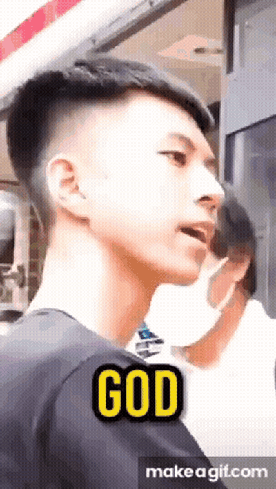 Young Man With Mask In Front Of Window Saying God GIF