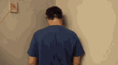 Young Man With Messy Hair Smiling In Black Sweater GIF