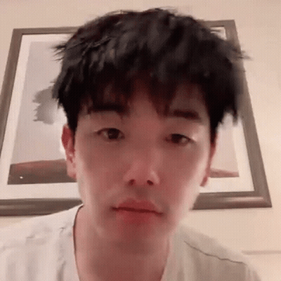 Young Man With Messy Haircut Making Funny Face GIF