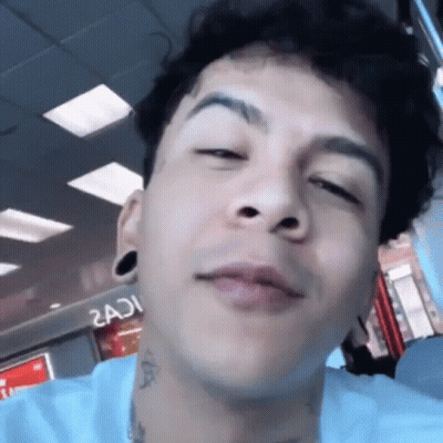 Young Man With Neck Tattoo Close Up GIF
