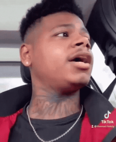 Young Man With Neck Tattoo Sitting In Car GIF