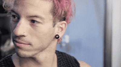 Young Man With Pink Hair And Black Earrings Mirror GIF