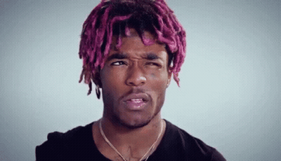 Young Man With Pink Hair And Dreadlocks Making Face GIF