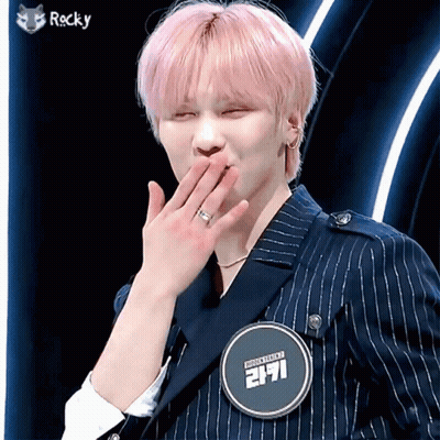 Young Man With Pink Hair And Rocky Badge GIF