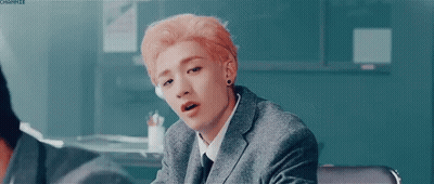 Young Man With Pink Hair In Suit And Tie GIF