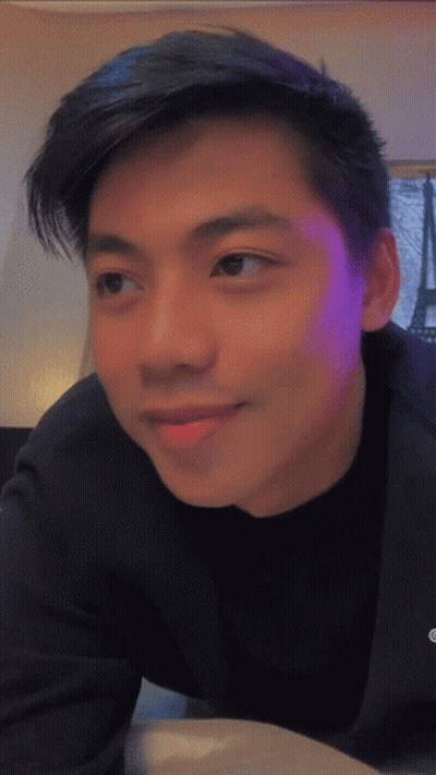 Young Man With Purple Backlight GIF