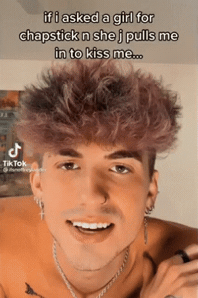 Young Man With Purple Hair Has TikTok Post On Face GIF
