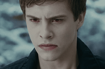 Young Man With Red Eyes Looking At Camera GIF