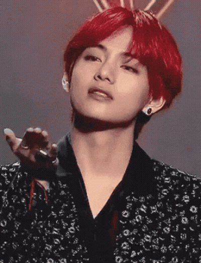Young Man With Red Hair And Black Jacket Holding Microphone GIF