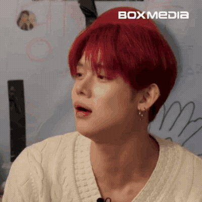 Young Man With Red Hair And Earrings GIF