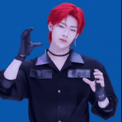Young Man With Red Hair In Black Shirt And Gloves GIF