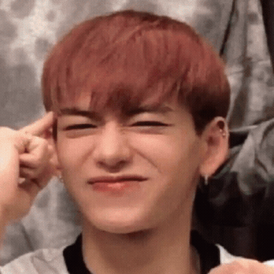 Young Man With Red Hair Making Funny Face And Holding Ear GIF