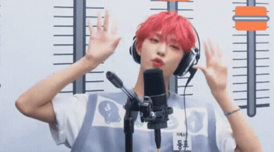 Young Man With Red Hair Wearing Headphones And Name Tag A GIF