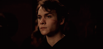 Young Man With Scar On Face Looking Down GIF