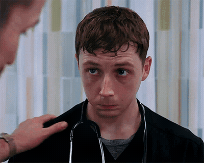 Young Man With Stethoscope Looks At Camera GIF