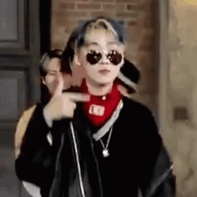 Young Man With Sunglasses And Red Bandana Pointing GIF