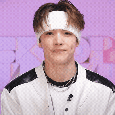 Young Man With White Headband And Necklace GIF