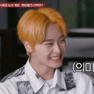 Young Man With Yellow Hair Smiling In White Shirt GIF