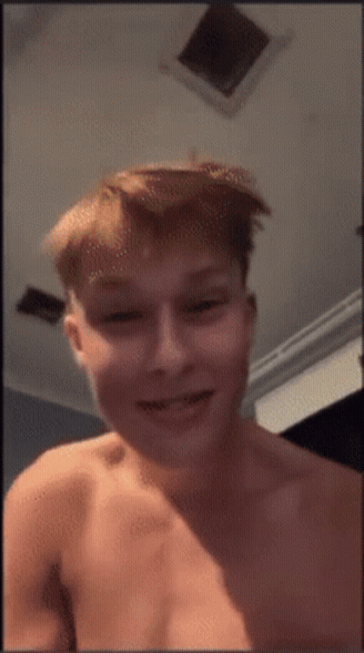 Young Man Without Shirt Smiling In Front Of Ceiling Fan GIF