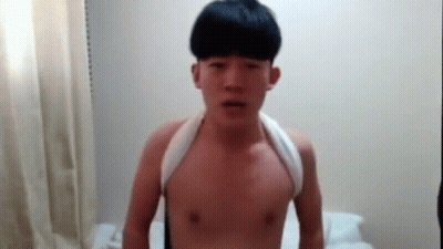 Young Man Without Shirt With Towel Around Neck GIF