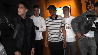 Young Men At Microphones Wearing It La Riot Shirt GIF