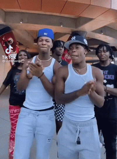 Young Men Clapping With NY Hat GIF