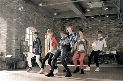 Young Men Dancing In Brick Wall Room GIF