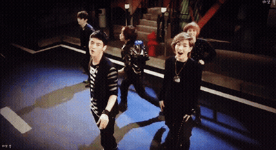 Young Men Dancing In Dark Room With RM Shirt GIF