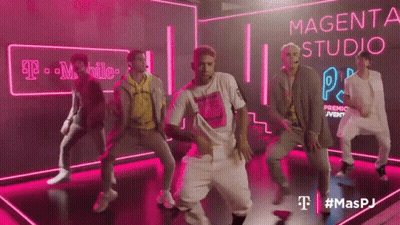 Young Men Dancing In Front Of Magenta Sign GIF