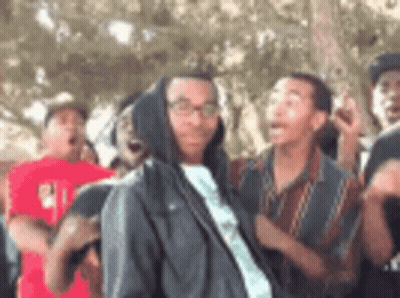 Young Men Dancing In Park GIF