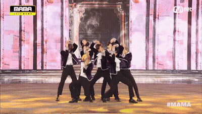 Young Men Dancing On Stage With Mama Logo GIF