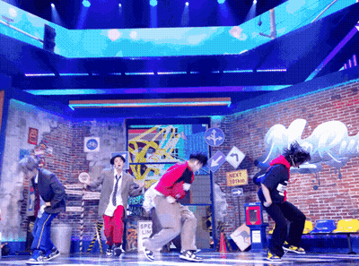 Young Men Dancing On Stage With Next Stop Sign GIF