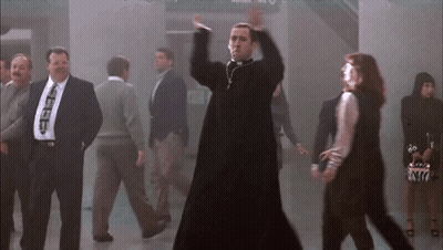 Young Men Dancing One Wearing Letter E GIF