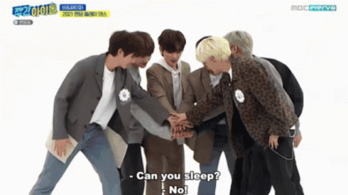 Young Men Huddled Asking To Sleep GIF