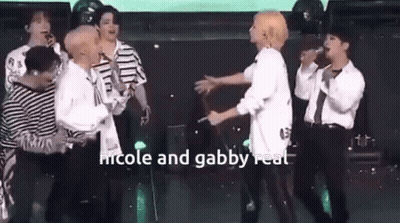 Young Men Hugging On Stage GIF